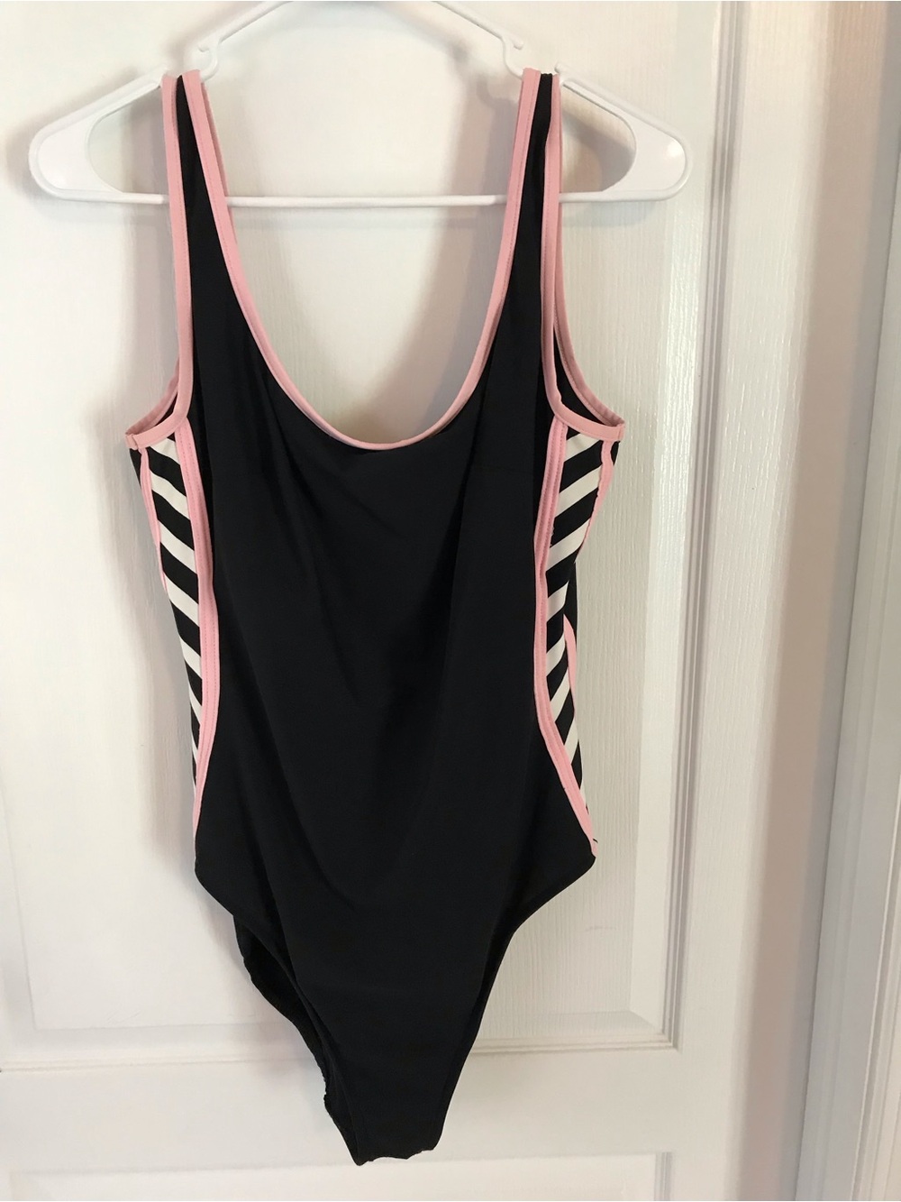 Black One-Piece Swimsuit with Pink Trim and Striped Side Panels